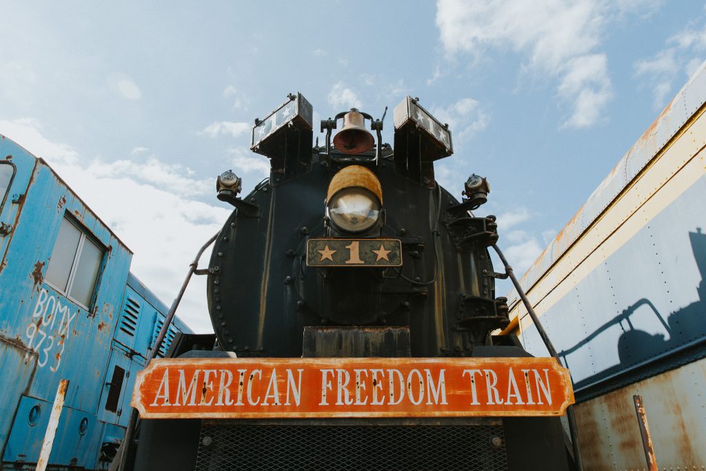 The American Freedom Train. A head-on shot of a black train with a red and gold sign that reads "The American Freedom Train"